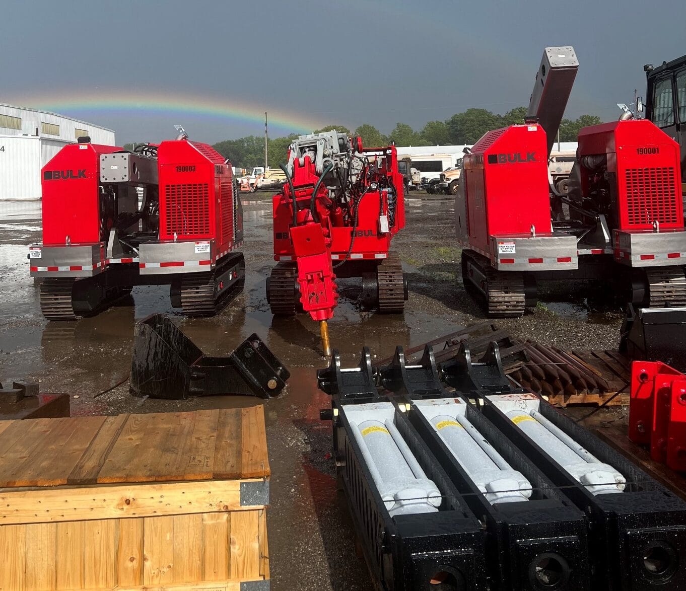 Bulk remote-controlled tear-out machines staged with hammers and attachments