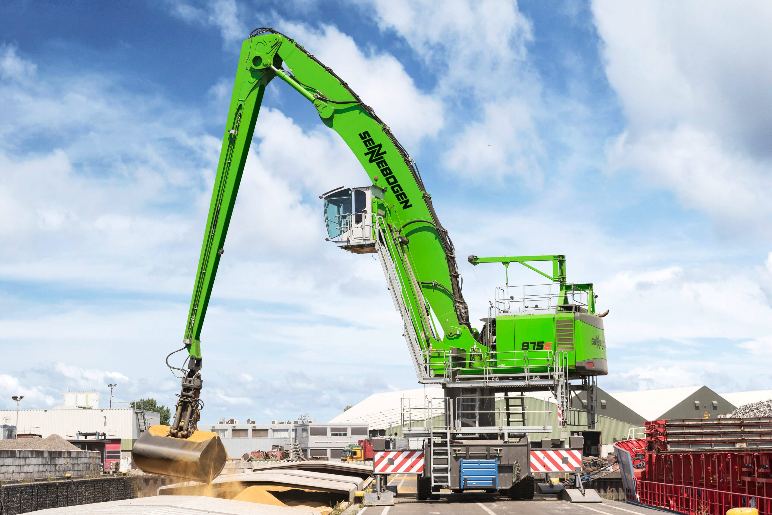 Sennebogen 875 material handler working cargo at a port