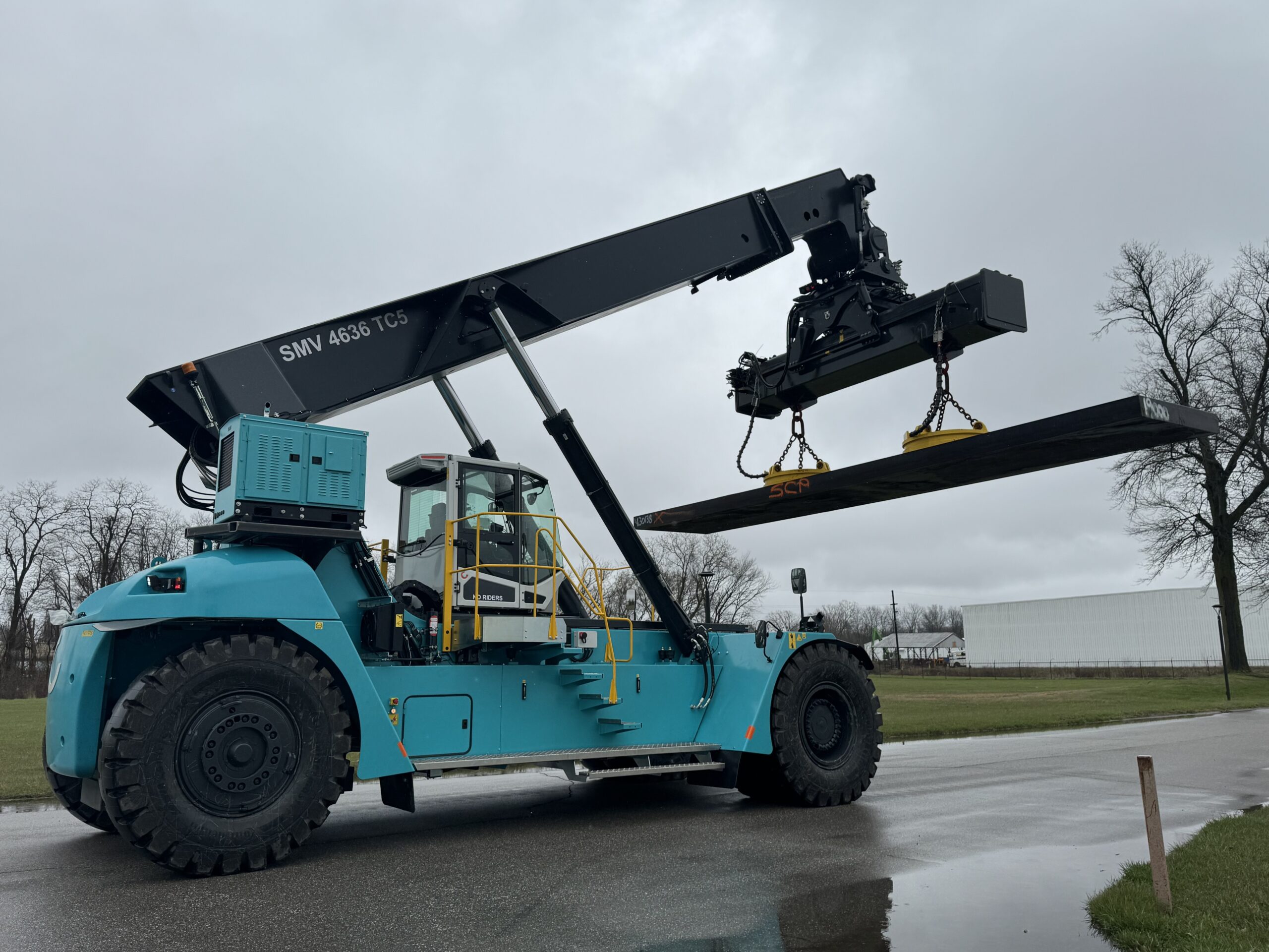 konecranes reach stacker picking up a steel slab