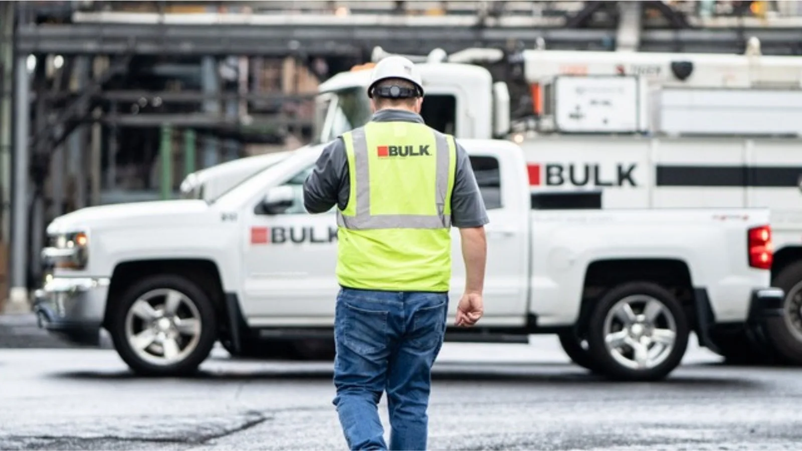 Bulk technician working at an industrial steel mill site